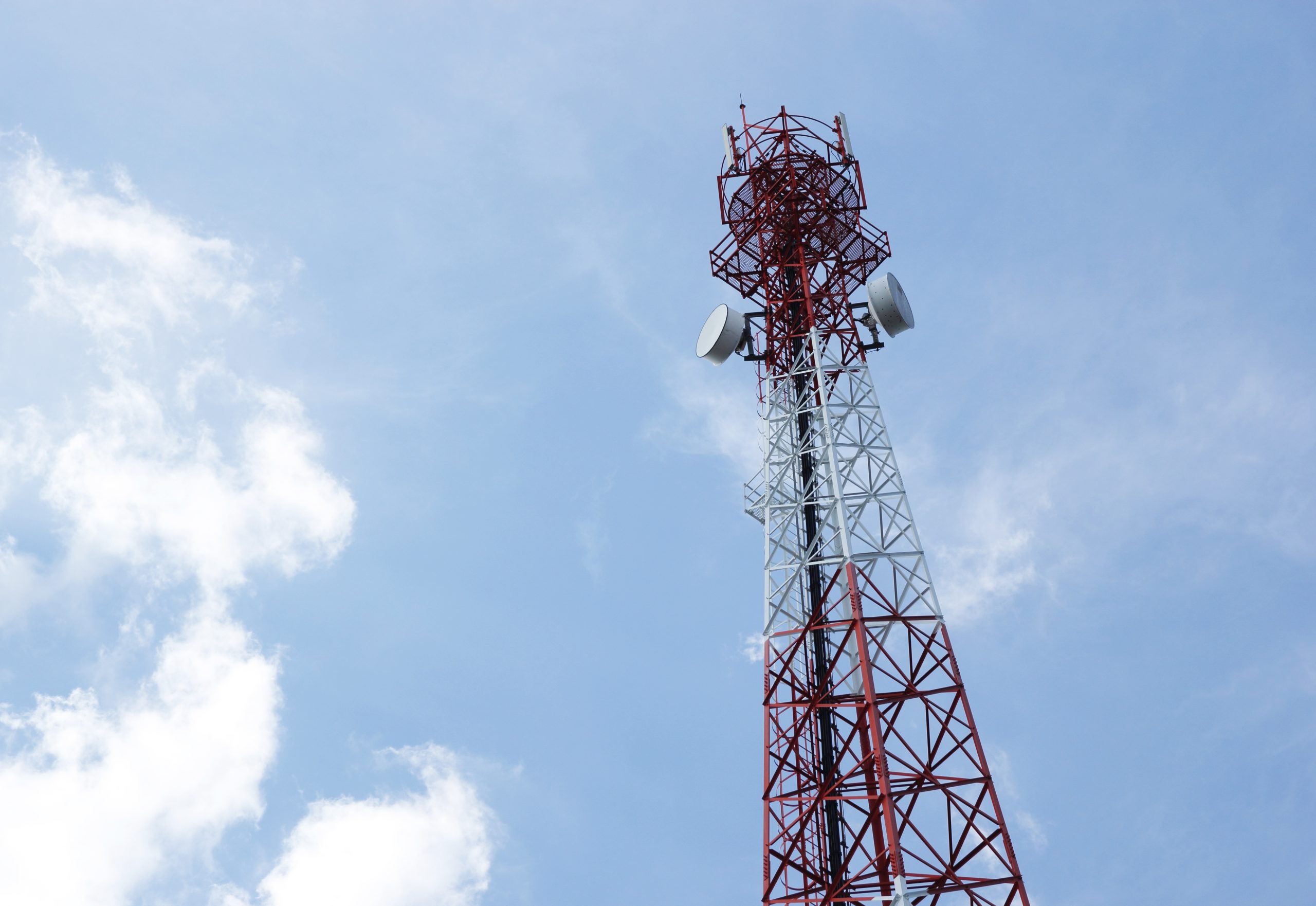 telecommunications antenna radio television telephone with cloud blue sky scaled